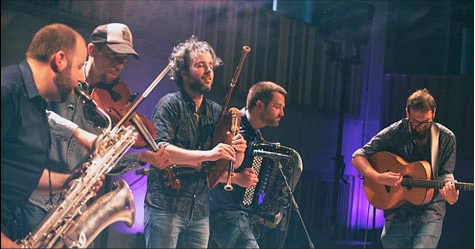 WÖR musicians playing a variety of instruments.